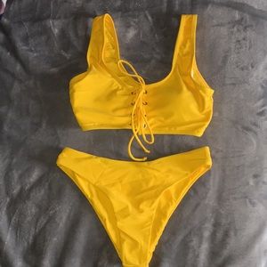 a yellow bikini set